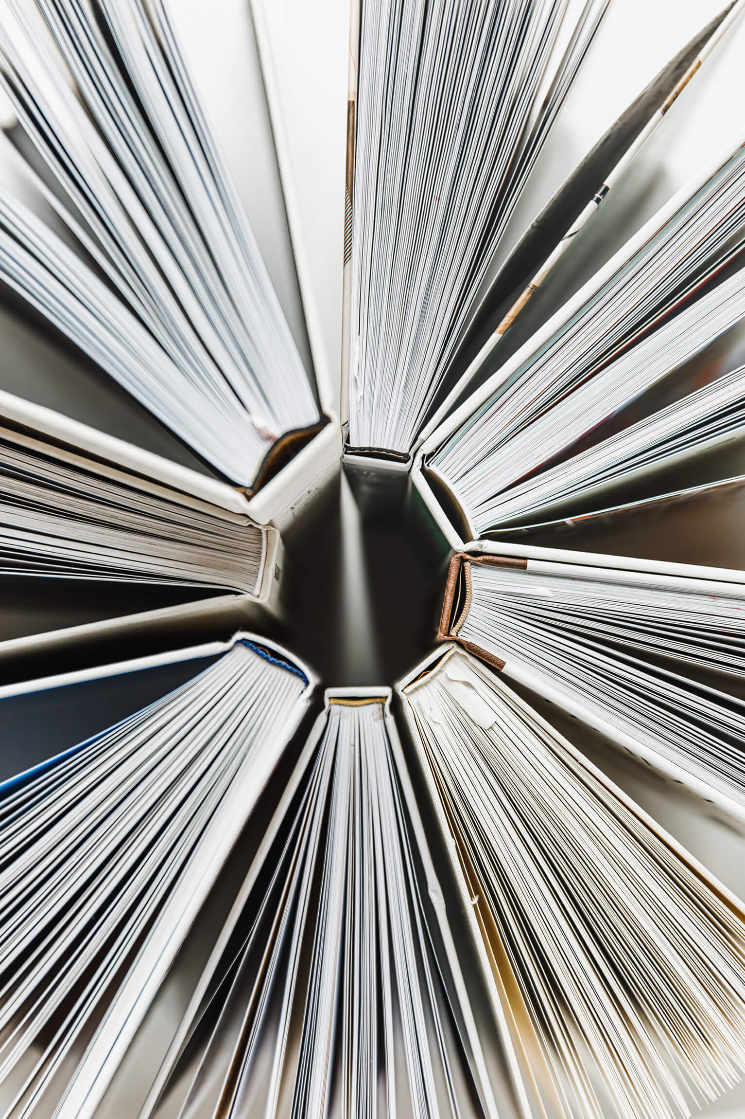 Books arranged in a circle with their covers touching